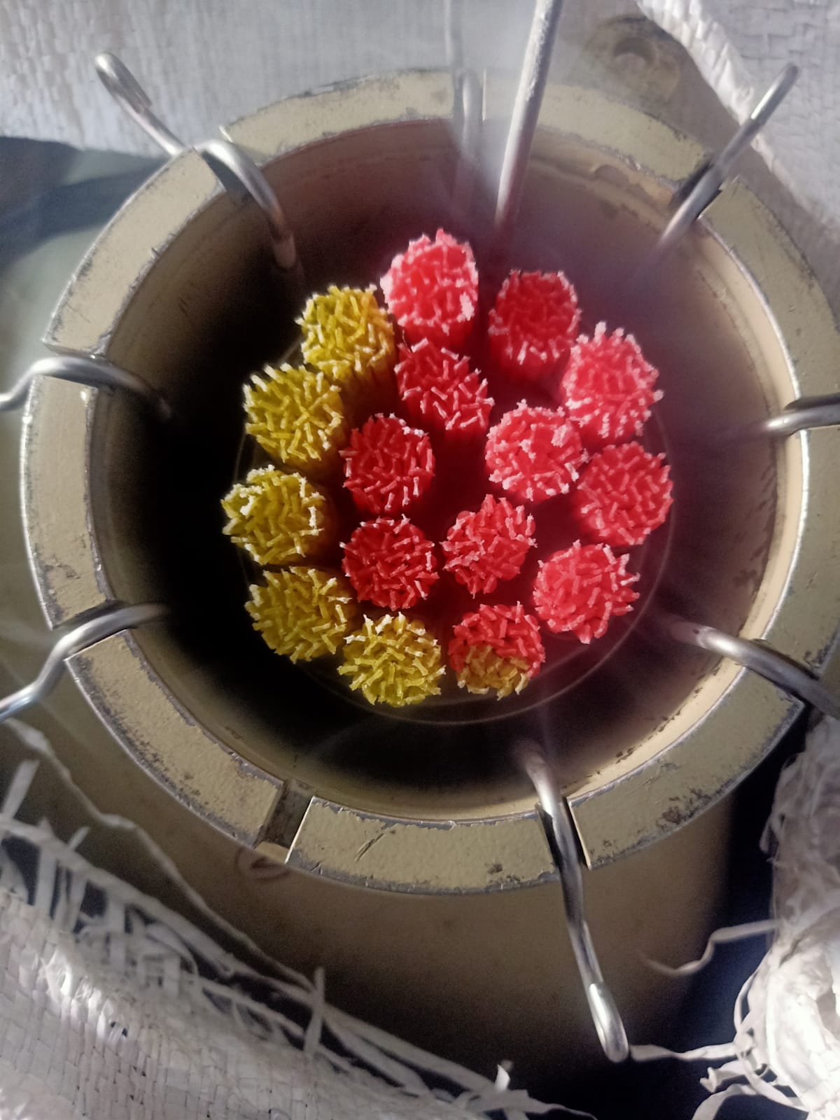 Cryogenic liquid nitrogen canister loaded with color-coded bovine semen straws at GVC Enterprises.