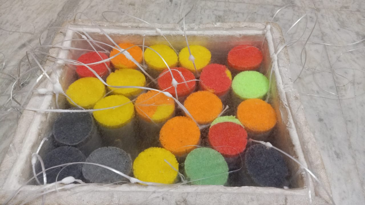 Cryogenic storage canister box with semen straws and retrieval lines.